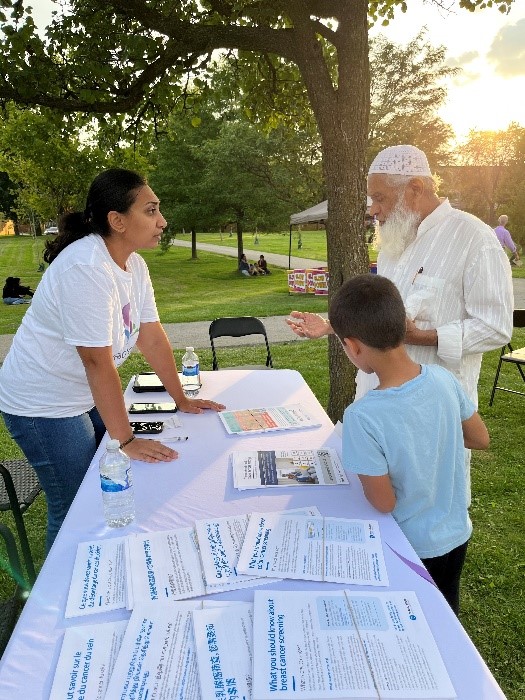Kishwar Ali, Coordinator, Engages with community members at the Ward 24 BBQ
